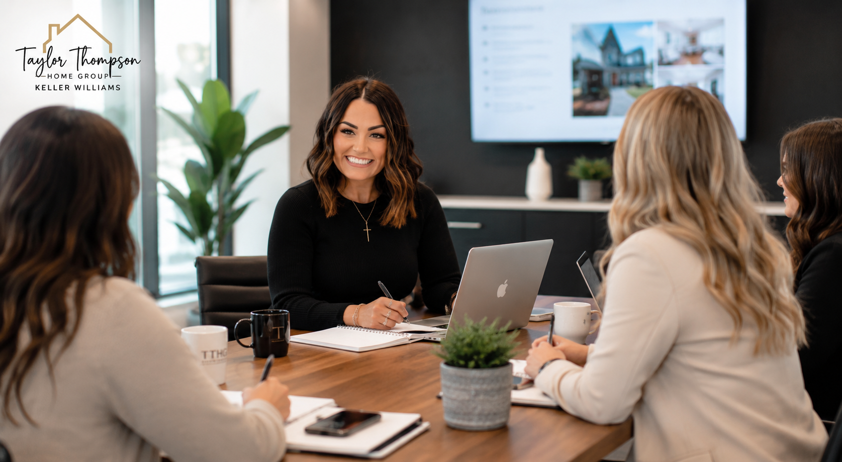 Professional real estate mastermind meeting with business planning materials representing leadership, growth, and industry collaboration at Taylor Thompson Home Group.